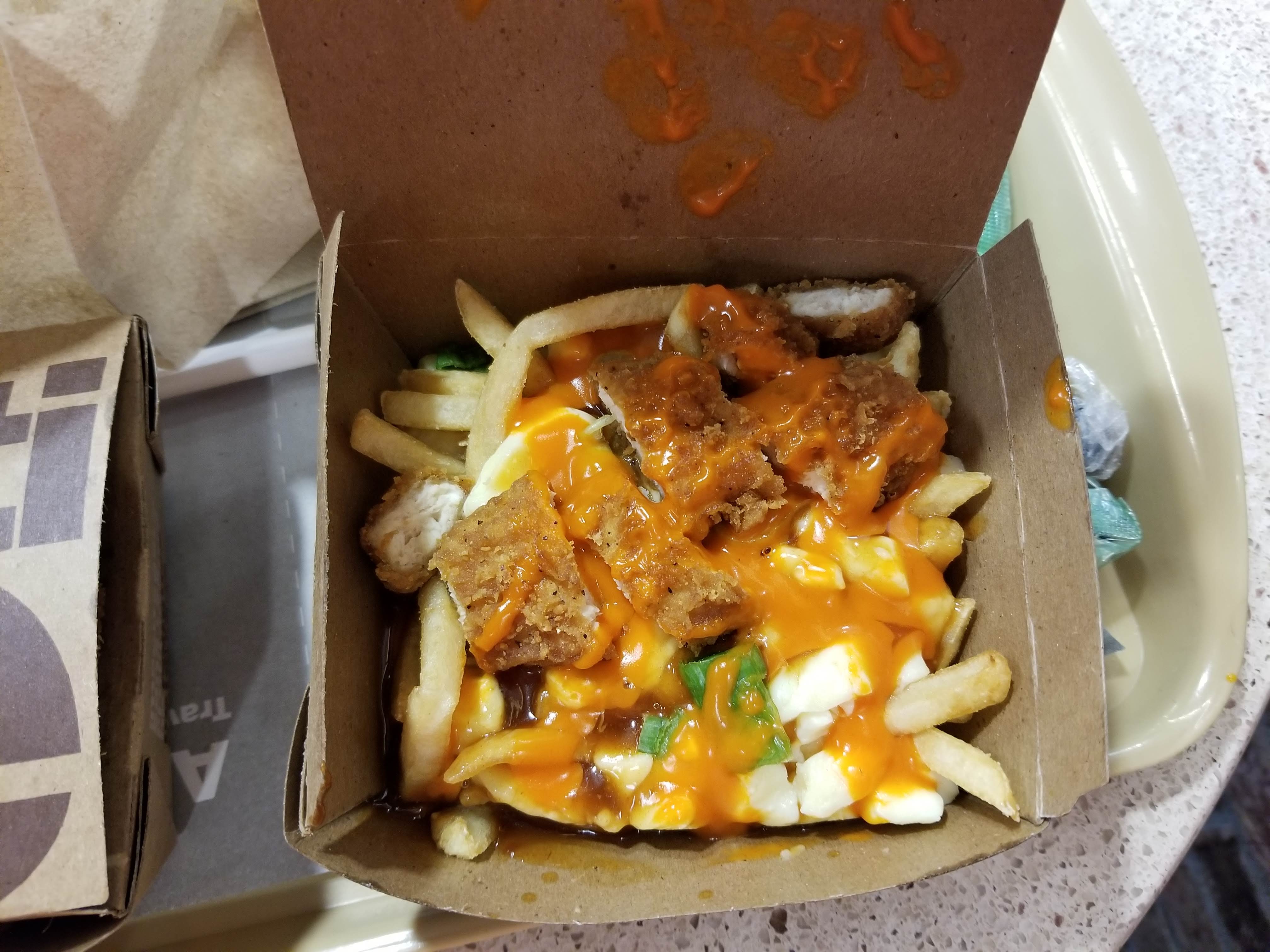 Cardbox box of buffalo chicken poutine